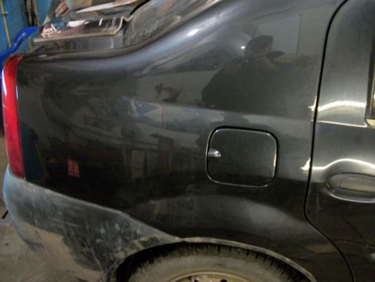 Renault Logan ремонт путем восстановления заднего крыла. Стоимость ремонта: 9500р.